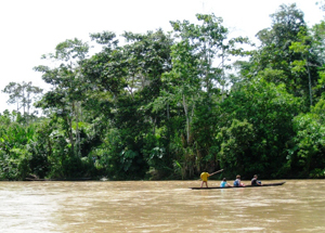 canoe on a muddy Amazon river