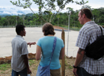 Native Ecuadorian man talking to two students