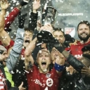 Soccer players celebrating a championship win