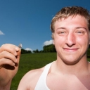 Student holding a 9,500 year old spear point