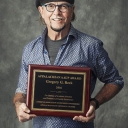 Dr. Gregory Reck with award plaque